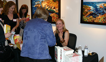 Author-Elisabeth Leamy-Signs her The Savvy Consumer at Consumer Credit Counseling Service Event