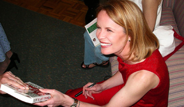 Author-Elisabeth Leamy-Hands a fan her book-The Savvy Consumer